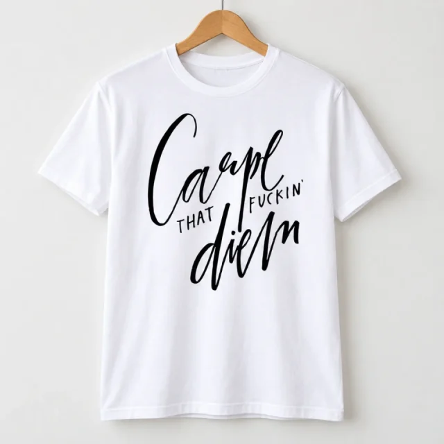 White short-sleeved T-shirt with Carpe That Fuckin Diem Graphic design on a hanger